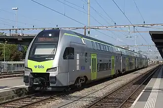 Silver train with green trim