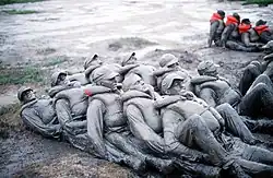 First Phase Trainees covered in mud.