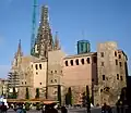 Remains of the wall at the Plaça Nova, with the Casa de l'Ardiaca above
