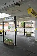 Beneath the station canopy.