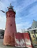 The minaret, built before the mosque