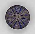 Bowl with radiating panels. Late 13th–early 14th century. Stonepaste with pigment and gilding over glaze. Yale University Art Gallery
