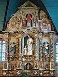 Retable of Saint Joseph, shown in the centre with the infant Christ.