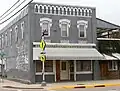 Building at Main and 6th Streets, looking northwest
