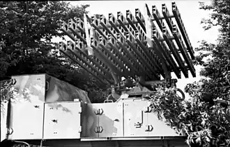 8-cm-Vielfachwerfer, a double rail launcher that fires twenty Katyusha-like rockets mounted on an armoured SOMUA MCG halftracked vehicle