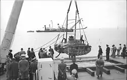 A Tauchpanzer III undergoing testing at sea. The crane ship Viper, which was to support Tauchpanzer operations, is in the distance.