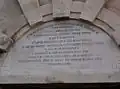 The inscription above the fortress gates.