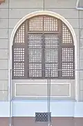 A Camarines Sur high-school building's large capiz-shell window