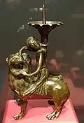 Gilt copper candlestick of Samson with lion, probably from Dinant (Belgium), c. 1200–1250