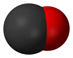 A large black spherical object with a slightly smaller red one merging into it from the right