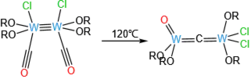 A reaction that cleaves the carbonyl ligand