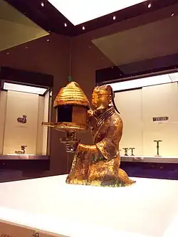 Changxin Palace lamp; circa 172 BCE; bronze and gold; height: 48&nbsp;cm; Hebei Provincial Museum (China); excavated from the tomb of Dou Wan