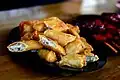 Filipino ngohiong is wrapped in lumpia wrappers rather than tofu skin