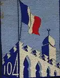 Insignia of CJF 104 (first model with number).