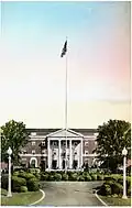 Front entrance with oversized flagpole