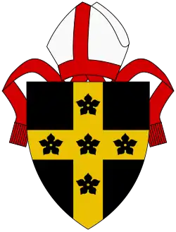 Sable, a cross Or with five cinquefoils sable