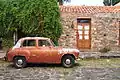 Old car parked on Calle Real in the historic district