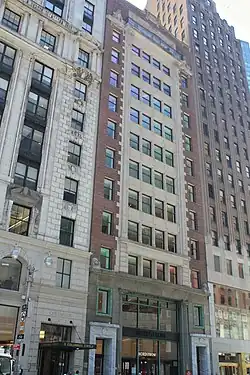 The facade of 1780 Broadway, a New York City designated landmark preserved at Central Park Tower's base, is made of limestone and brick.