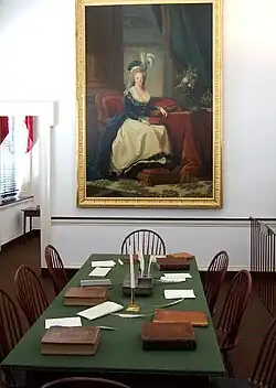 Table with chairs with picture in background.
