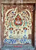 Damaged, dilapidated, and dirtied fresco showing floral motifs