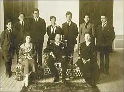 With family and children after his resignation.