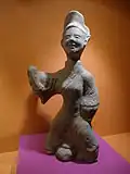 A woman wearing a cross-collared banbi, Han dynasty.