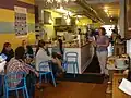 Owner Doreen Valentine discusses cupcakes with visitors