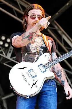 Hughes performing in 2010