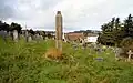 The remains of a monumental cross in the centre of the cemetery
