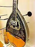 Modern bouzouki with inlaid rosette and scratch plate.