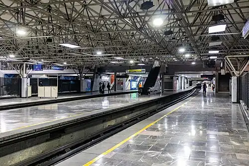 Picture of people waiting on the station's platforms.