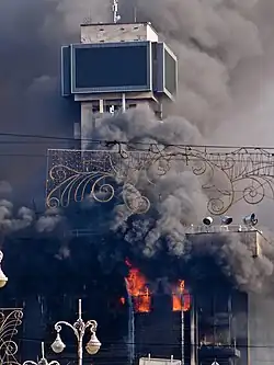 Image 2 Burning of the Trade Unions Building Photograph: Amakuha The burning of the Trade Unions Building—used as the headquarters of the Euromaidan movement—during the 2014 Ukrainian revolution, following a failed attempt by the Ukrainian police to capture the building. After the fire, the damaged building was covered with large canvas screens on two sides with the words "Glory to Ukraine" printed on them in large letters. More selected pictures