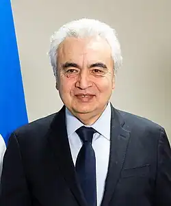 Shoulders and face of a man wearing a suit