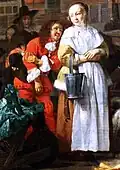 While a young woman waits for the poultry seller, a young man in theater costume speaks to her.