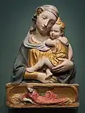 Virgin and Child and Reclyning Eve, the latter recurring as Maria in the Nativity on the North door, by Ghiberti or after him, 1430s, Bode Museum, Berlin