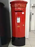 Glass-fibre type PB58 pillar box in Edinburgh, displaying a decal showing a simplified version of the Crown of Scotland