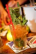 Glass of Golden Mojito with Brugal Añejo.