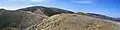 The Great Alpine Road winds across Mount Hotham, clinging to the side and ridge of the mountain