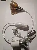 Two H-track fixtures for mains-voltage light bulbs, by Hampton Bay. Model No. EC719 (white, E26/[PA]R20) ES0208SBA (brown, GU10/MR16).