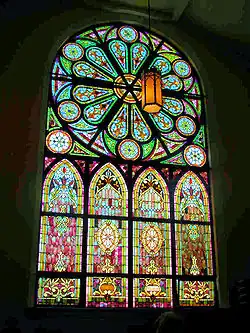 Large stained glass window with rose window