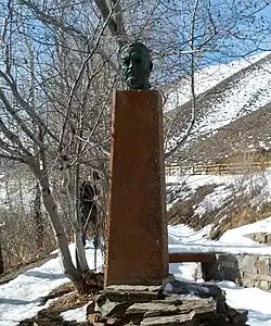 photograph of a stone memorial in the snow