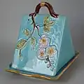 Coloured glazes cheese keep, naturalistic style.