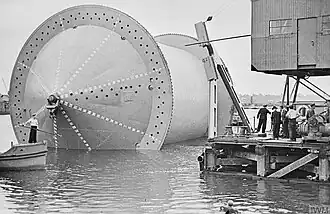 A Conundrum being moved into position into a specially constructed dock in preparation for the winding on of the pipe.