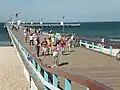 Pedestrians and bicycle drivers on the pier