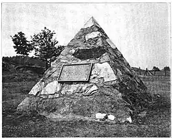Monument erected 1904 by the Jackson Iron Company at the site of the discovery of ore after destruction of the stump. The monument is now located on US&nbsp;41.[11]