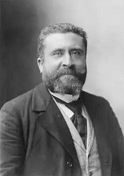 Black and white photograph of a man facing forward.