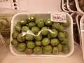 Green fruits in a supermarket in the Dominican Republic