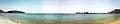 Image 9A view of the Khor Fakkan beach and port in the distance. The Khor Fakkan Container Terminal is the only natural deep-sea port in the region, and one of the major container ports in the UAE.
