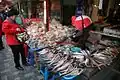 A merchant selling dried fish (2009)