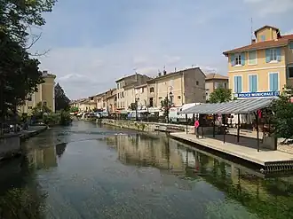 The village of L'Isle-sur-la-Sorgue, with the river in the foreground